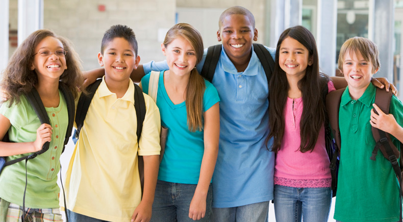 A group of kids standing next to each other.