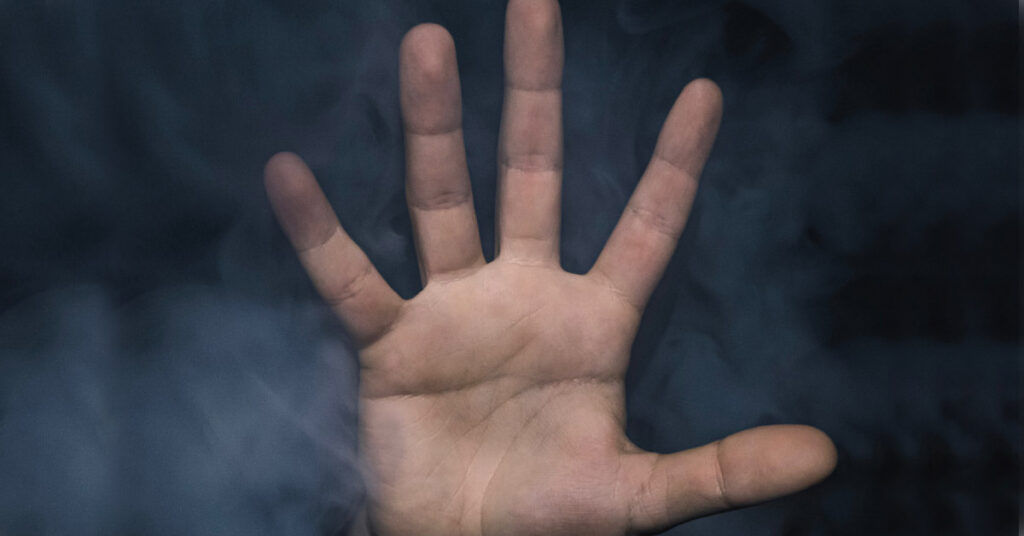 A hand with smoke coming out of it.