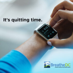 A person is holding their watch and saying it's quitting time.
