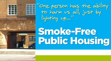 A picture of the front of a building with smoke free public housing written on it.